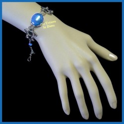 Bracelet du Pérou avec demie-sphère de verre bleu irisé