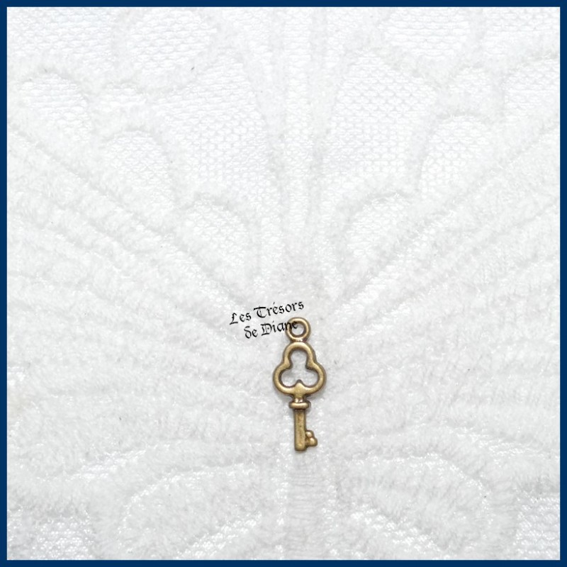 Charm PETITE CLE bi-face Charm PETITE CLE bi-face